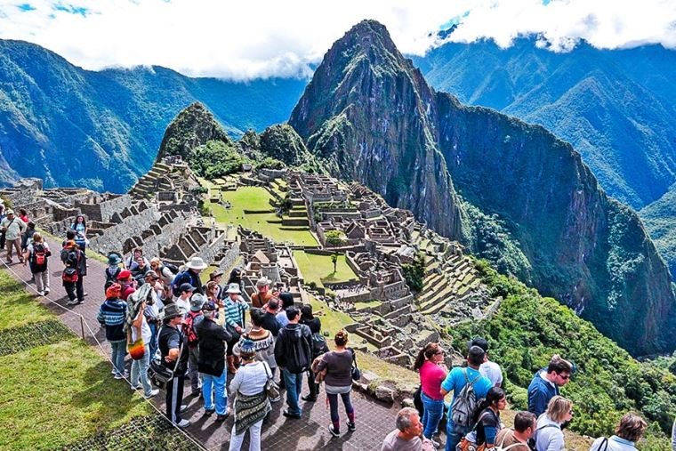 Why should travel to Machu Picchu